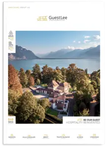 LEE_Brochure Aerial view of GuestLee luxury rental estate in Swiss Alps, Geneva to Zermatt, with lake, trees, and mountains on brochure cover. | GuestLee luxury rental Switzerland