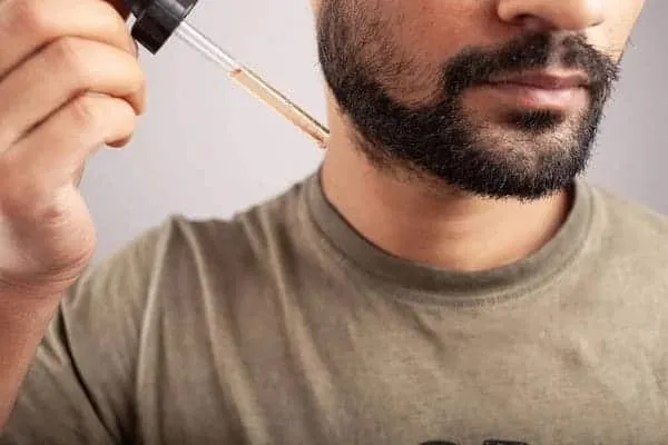 minoxidil being applied to beard for growth