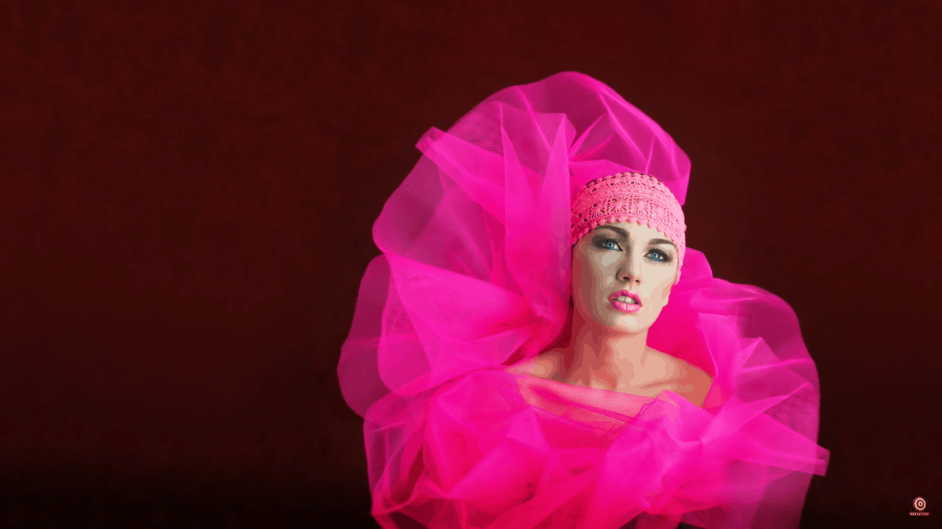 Model in front of velour backdrop wrapped in pink tulle