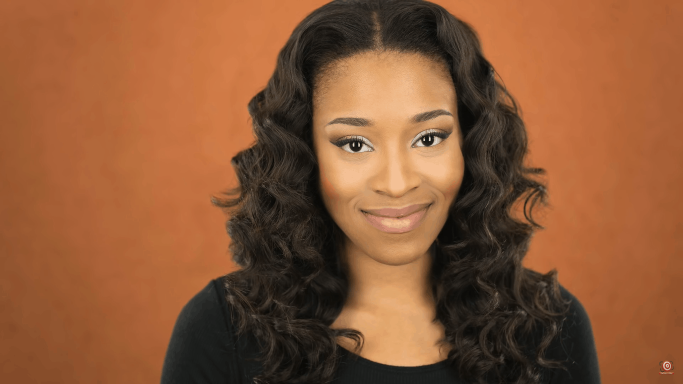 Model with brown velour backdrop