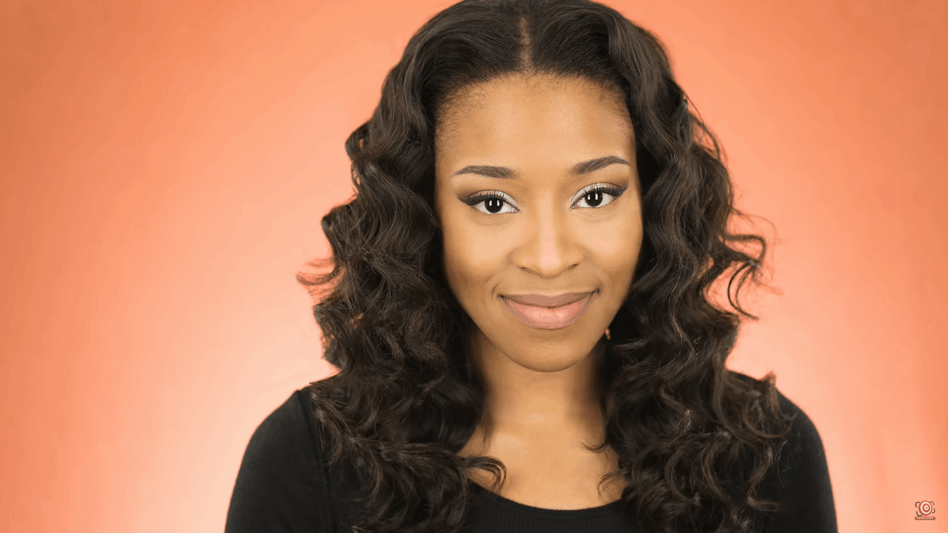 model in front of lit peach velour backdrop