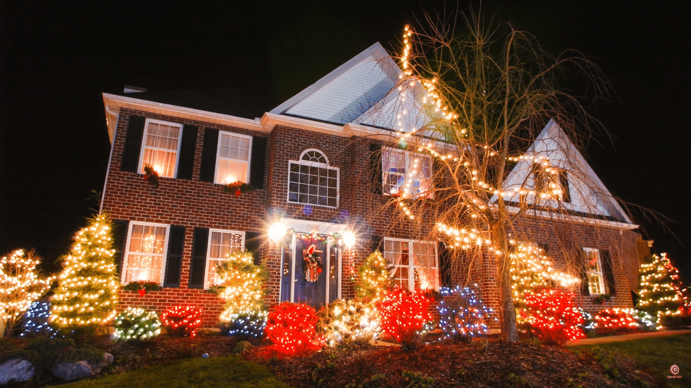 house with Christmas lights taken with shutter drag