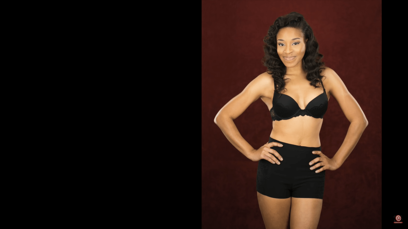 Model in front of velour backdrop three quarter length shot