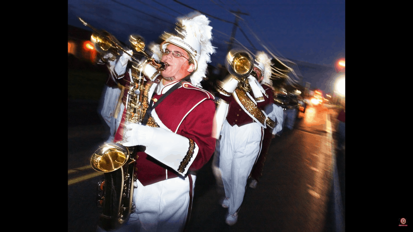 Saxophone player in marching band, shot with shutter drag