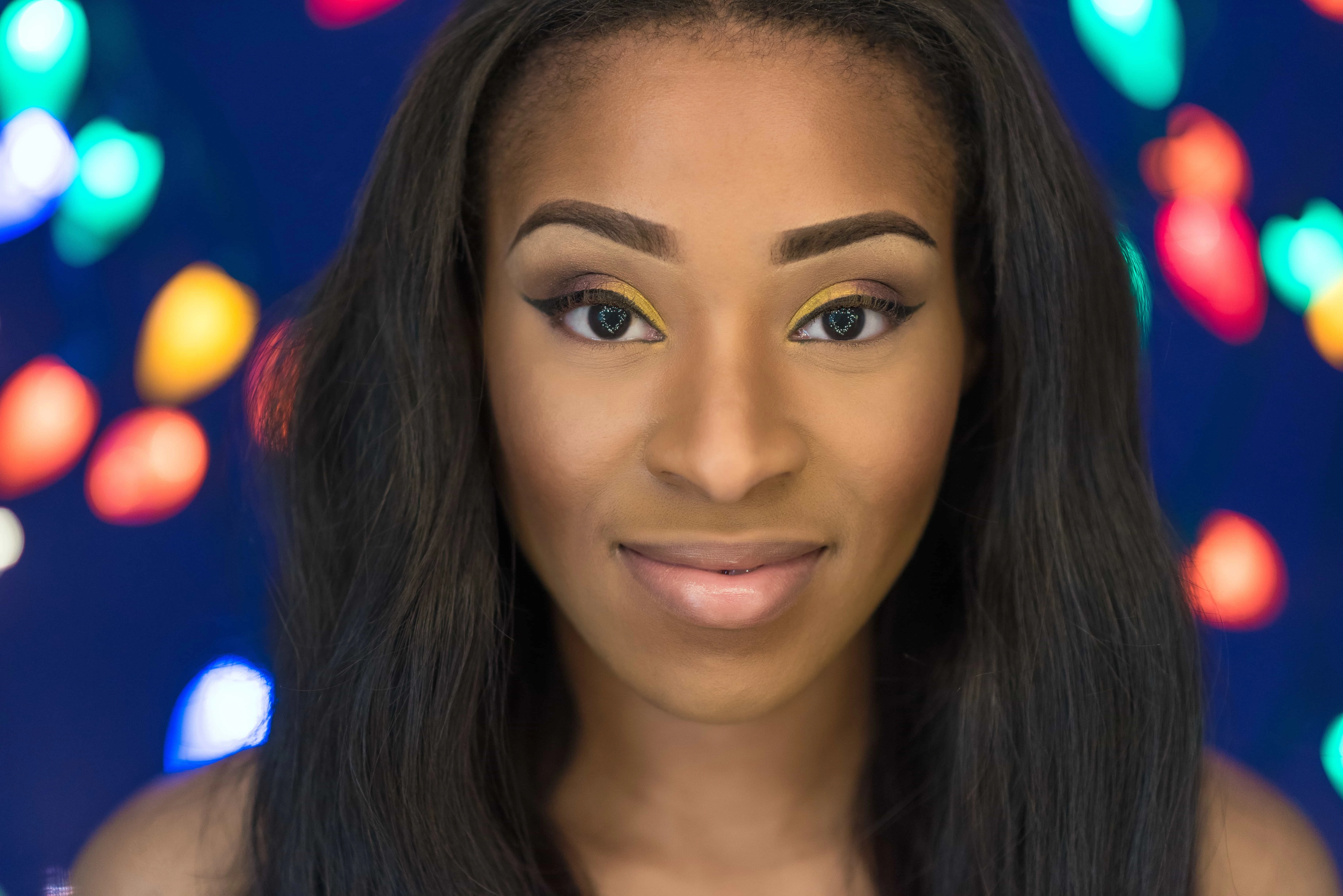 First of DIY Christmas Light portraits Monae with purple background and blurred colored lights behind her