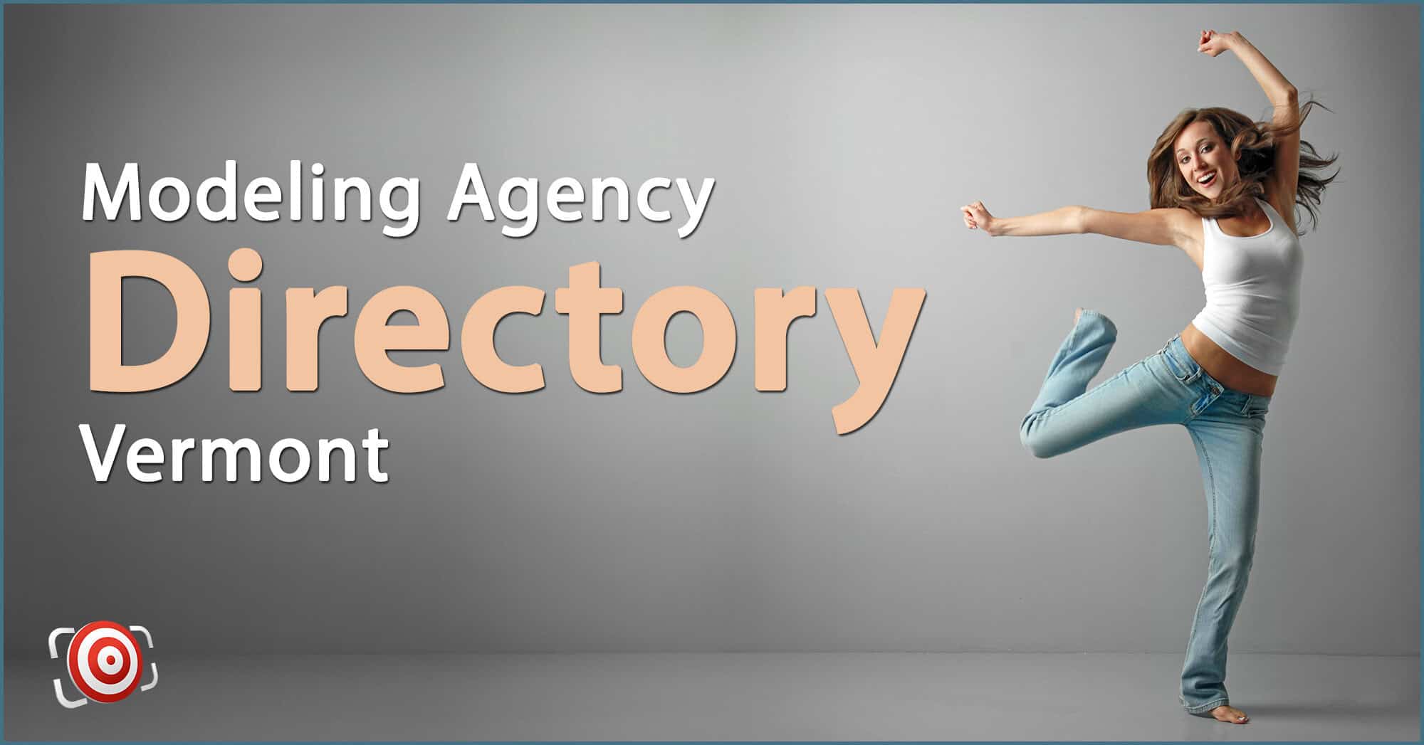 A woman in jeans and a tank top jumps joyfully in front of a backdrop with the text "Modeling Agency Directory Vermont," capturing the excitement and energy mirrored by modeling agencies in Rhode Island.