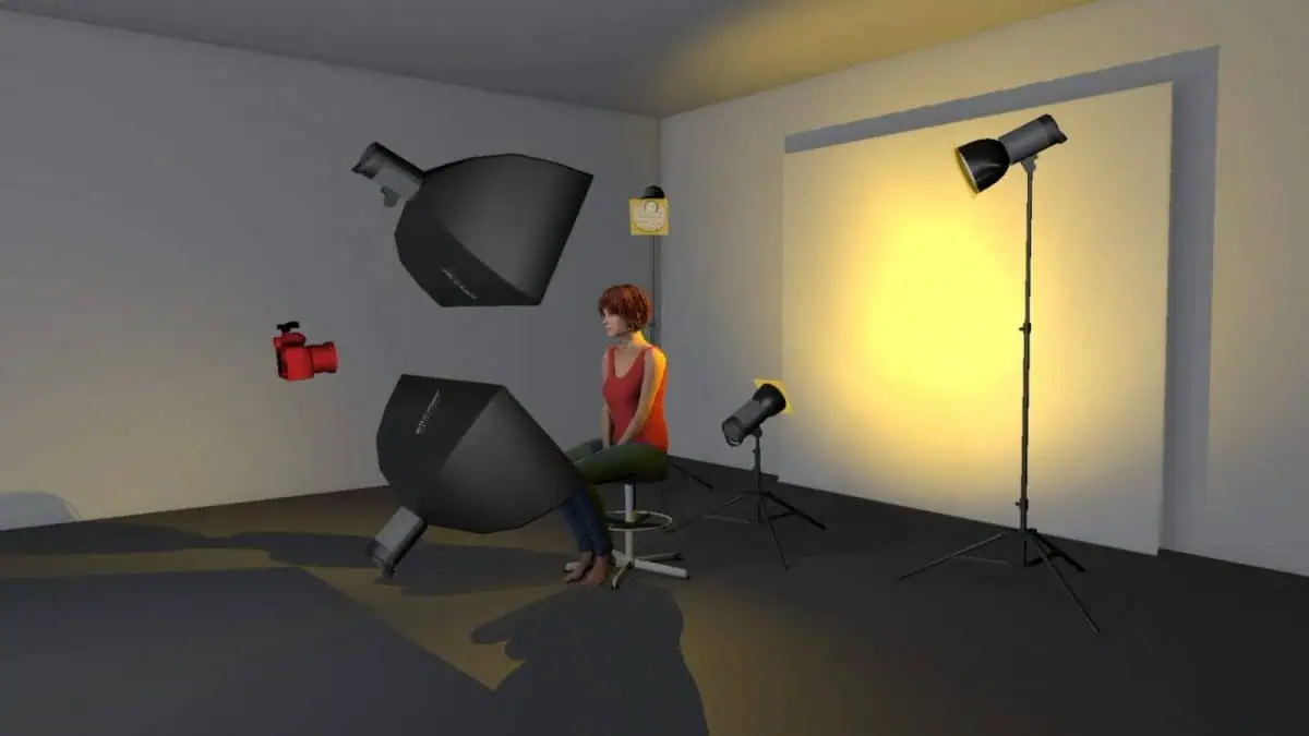 A person is seated in a studio surrounded by photography equipment, including lights and a camera. Capturing the essence of fashion portraits with cellophane, the room is bathed in a warm yellow light.