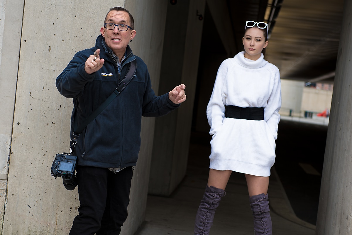 Photographer Joe Edelman with model Gabrielle Brown instructing attendees at a street fashion photo walk in New York City.