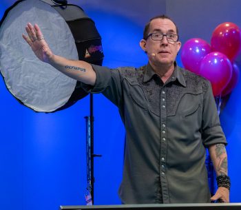 Joe Edelman on stage for Olympus at WPPI