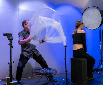 Joe Edelman on stage for Olympus at WPPI