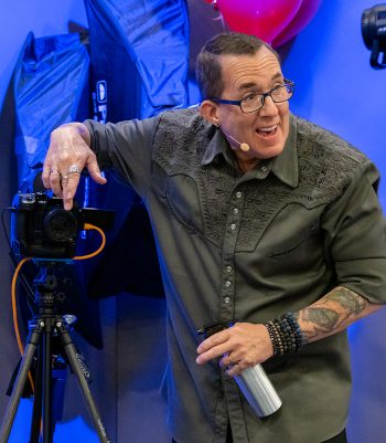 Joe Edelman on stage for Olympus at WPPI