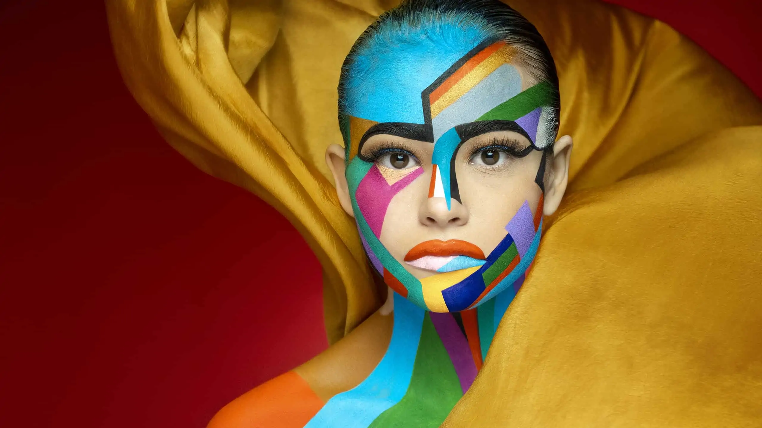 A woman with colorful makeup on her face.