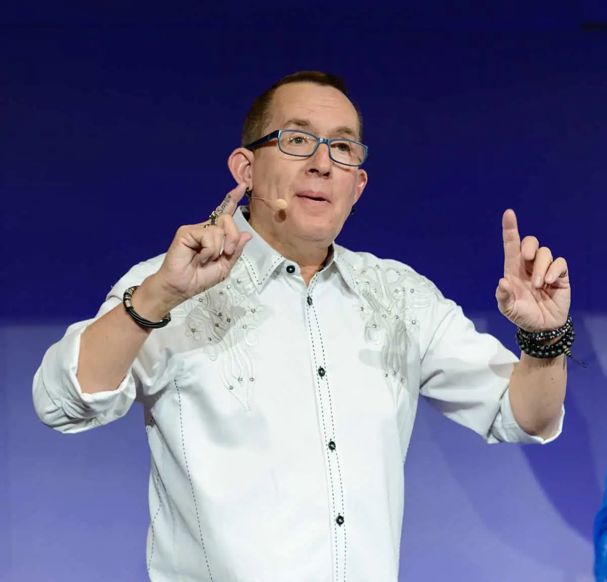 A man wearing a white shirt.