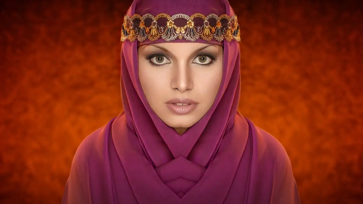 A beautiful muslim woman in a purple hijab.