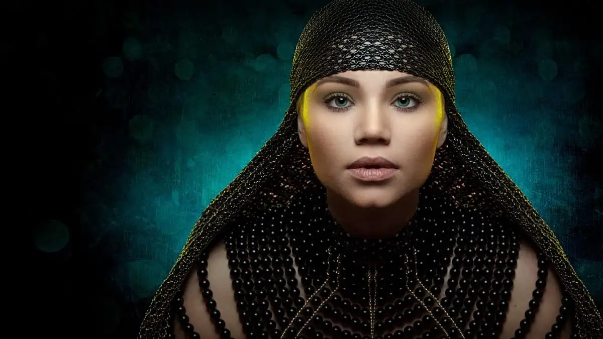 An image of a woman in a beaded headdress.
