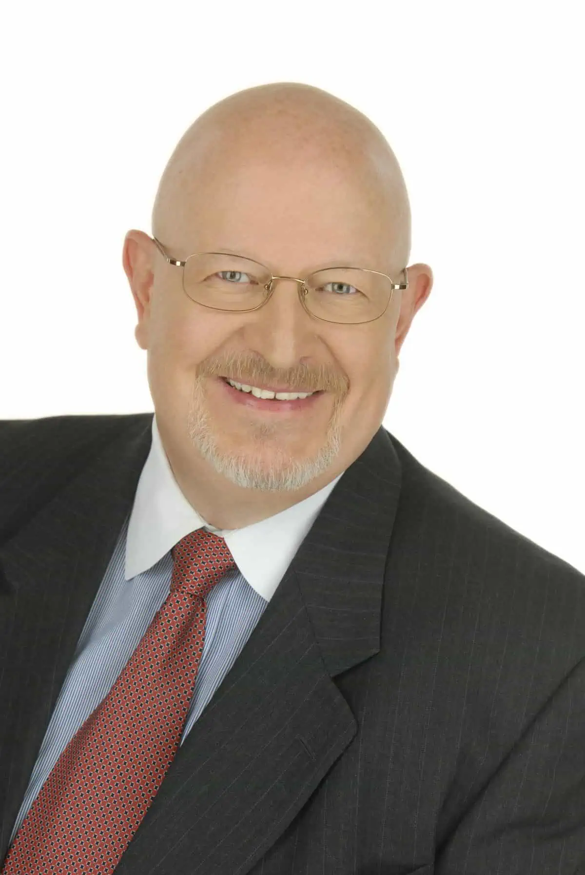 A bald man in a suit and tie.