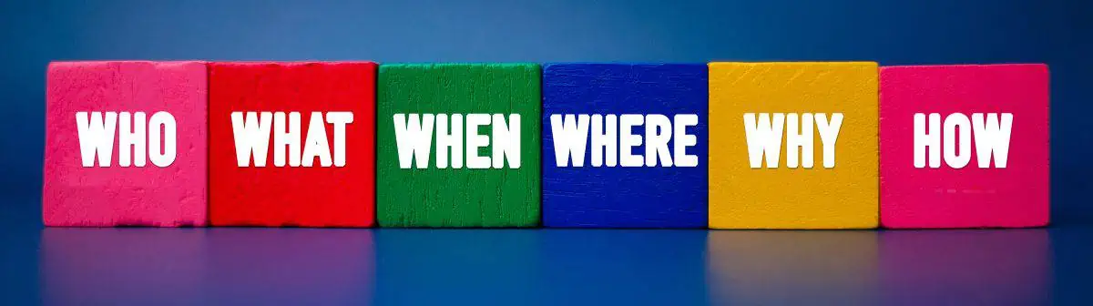 A row of colorful blocks with the words who what when where why how.