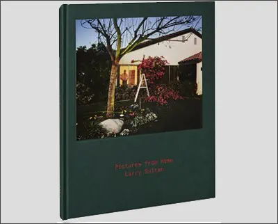 A book with a picture of a house and a tree.
