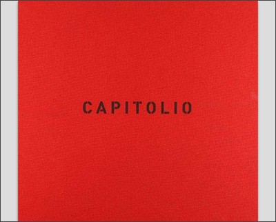 A red cover with the word capitolio on it.