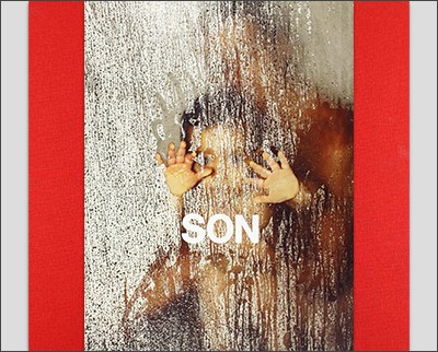 The cover of son, with a child's hand reaching through a window.
