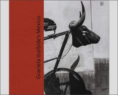 A black and white photo of a bicycle with a bull on it.