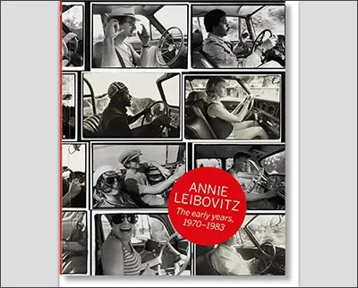 A black and white photo of a woman driving a car.