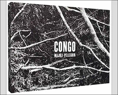 A black and white photo of a tree with the words Martin Parr on it.
