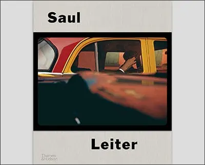 Cover of a book featuring a photograph by Saul Leiter with a partial view through a taxi window.