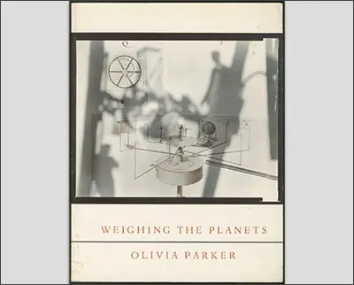 A vintage-style photo exhibiting an artistic representation titled "weighing the planets" by Kyle Cassidy.