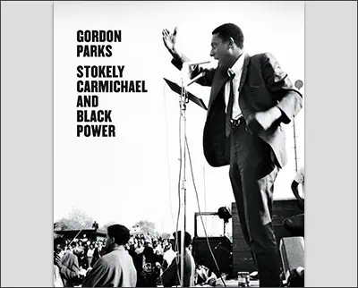 A man singing into a microphone, photographed by Bert Stern.