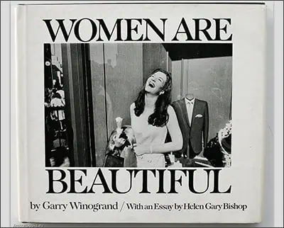 Cover of the book "women are beautiful" by garry winogrand featuring a black and white photo of a woman laughing in front of a shop window.