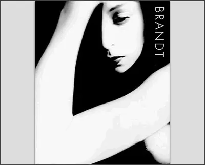 Black and white image of a person with their arm raised over their head, partially shadowing their face. The word "Brandt" is vertically aligned on the right side.