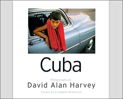 Book cover featuring a young person in a car window with a red scarf. The title "Cuba" and credits "Photographs by David Alan Harvey, Essays by Elizabeth Newhouse" are displayed on the cover. This captivating image mirrors the evocative style of Joe McNally's iconic photography.