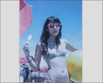 A woman in a bikini, reminiscent of a classic Joe McNally shot, holds a popsicle and a beach ball while wearing sunglasses. Other beachgoers and colorful umbrellas create a lively backdrop, capturing the essence of summer fun.