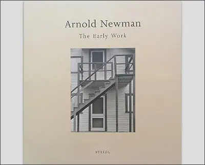 Cover of the book "The Early Work" by Arnold Newman, featuring a black-and-white photograph reminiscent of Margaret Bourke-White, depicting an exterior staircase on a white building.