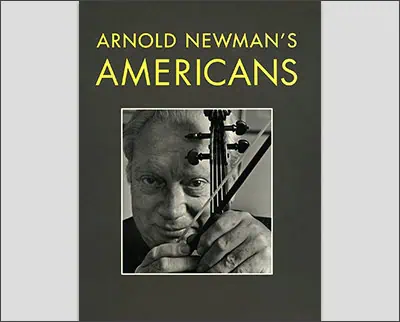 Book cover titled "Arnold Newman's Americans" featuring a striking black and white photo, reminiscent of Margaret Bourke-White's style, showcasing a person holding a musical instrument.