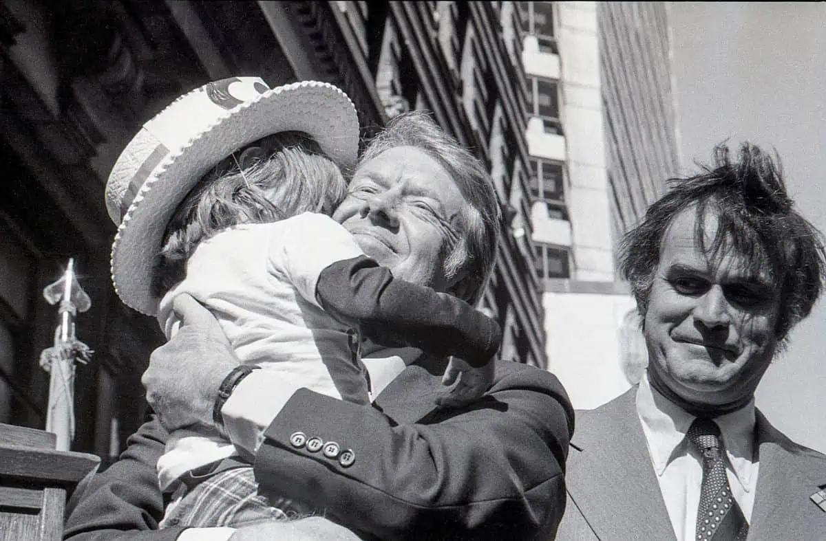 Democratic presidential candidate Jimmy Carter hugs a young child during an outdoor rally at 15th and Chestnut Streets in Philadelphia, PA on October 29th, 1976