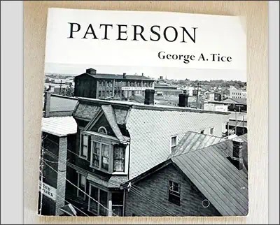 Cover of "Paterson" by George A. Tice, showing a black-and-white aerial view of rooftops in an urban area.