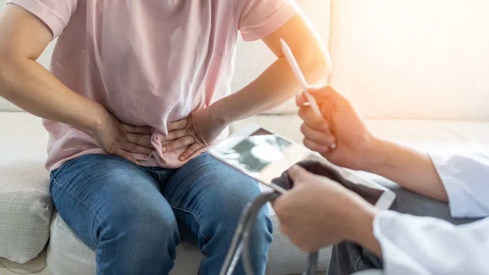 Patient undergoing medical examination for acid reflux symptoms with a doctor.