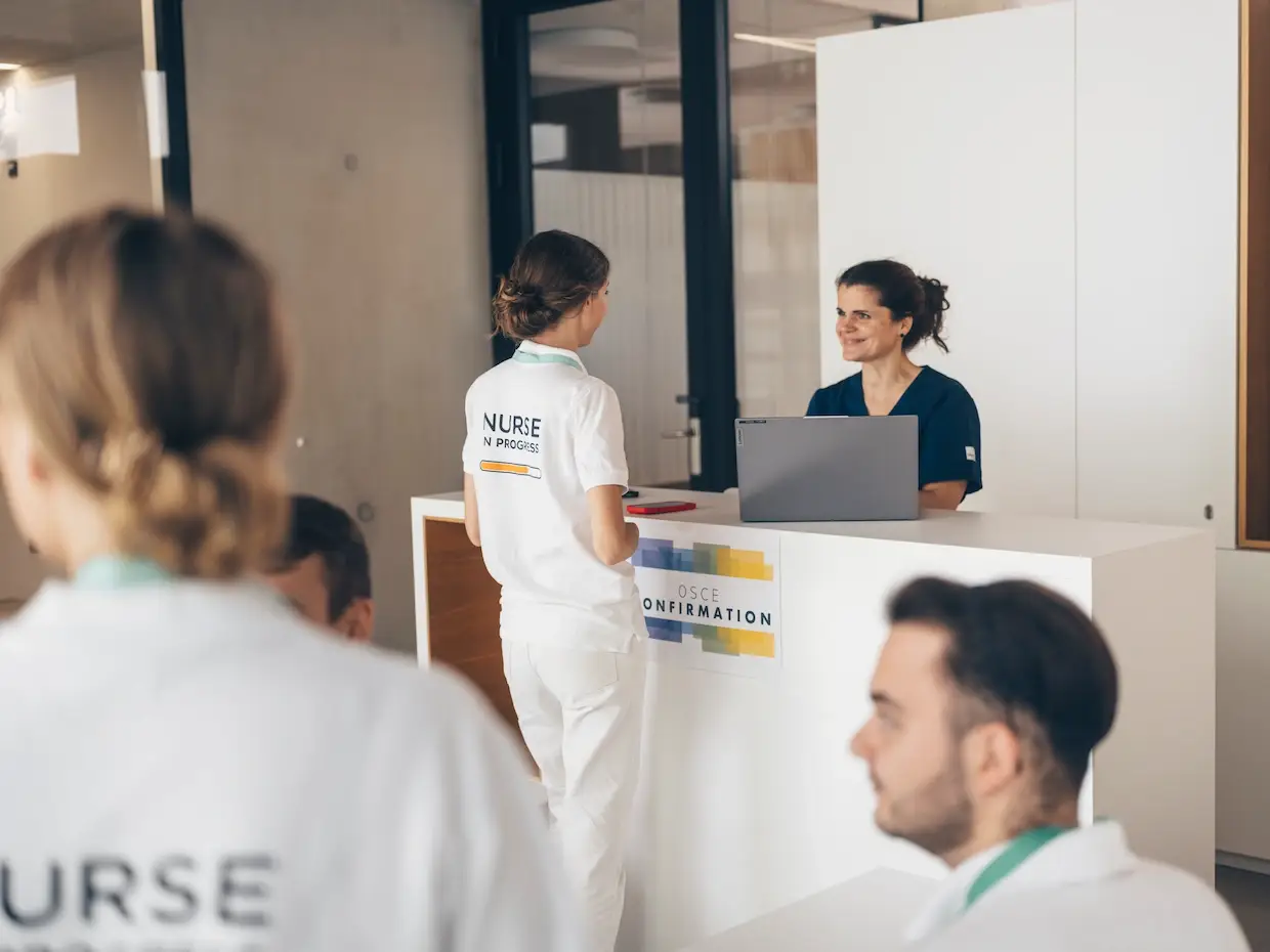 During check-in, students confirm their attendance and receive their code, which they use to log in at the OSCE stations.