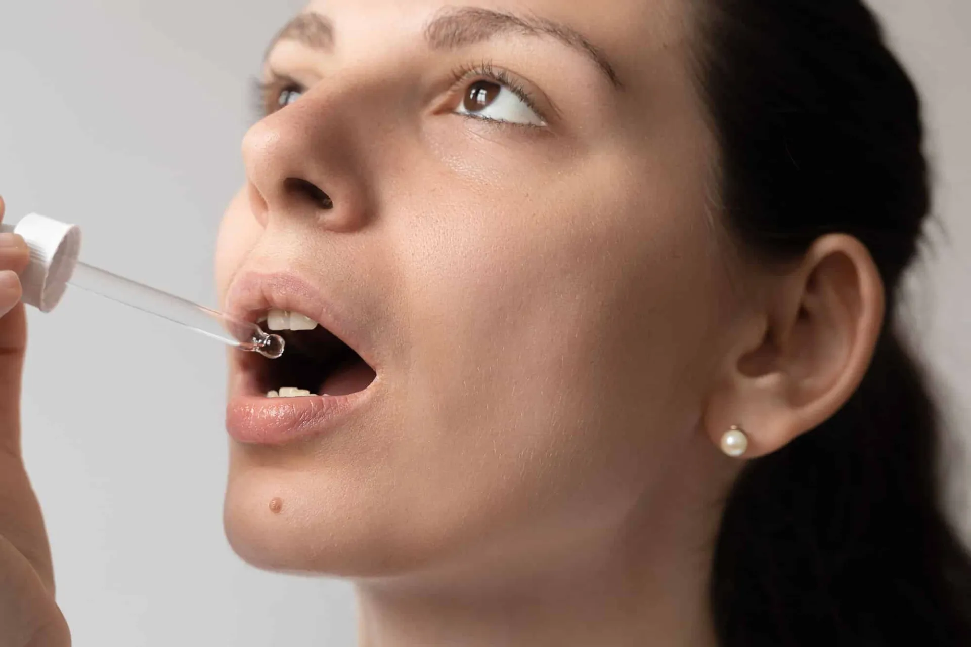 Taking Oil Supplement With Dropper