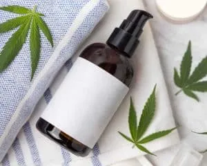 dropper bottle on towel and cannbis