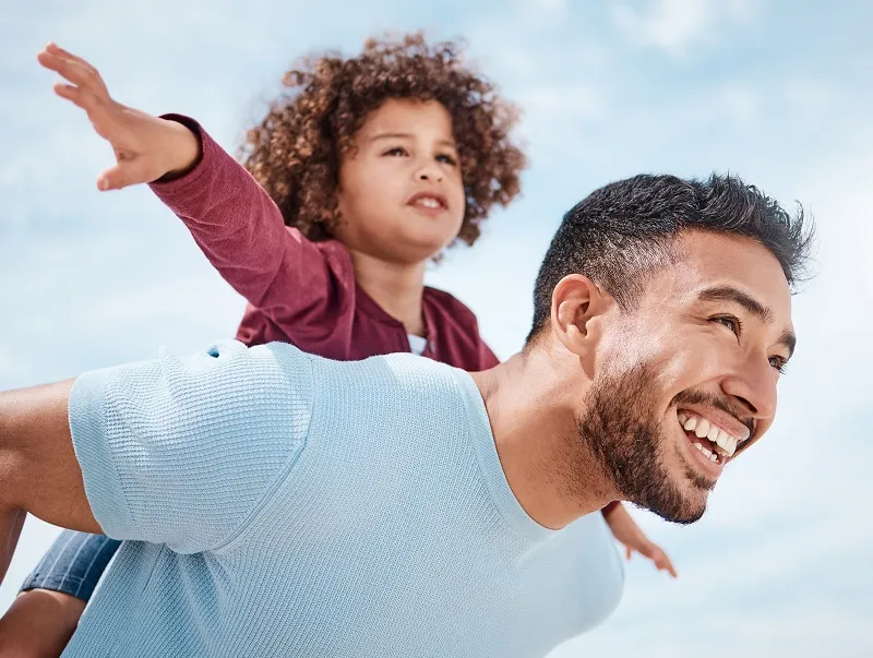 dad and daughter playing outside
