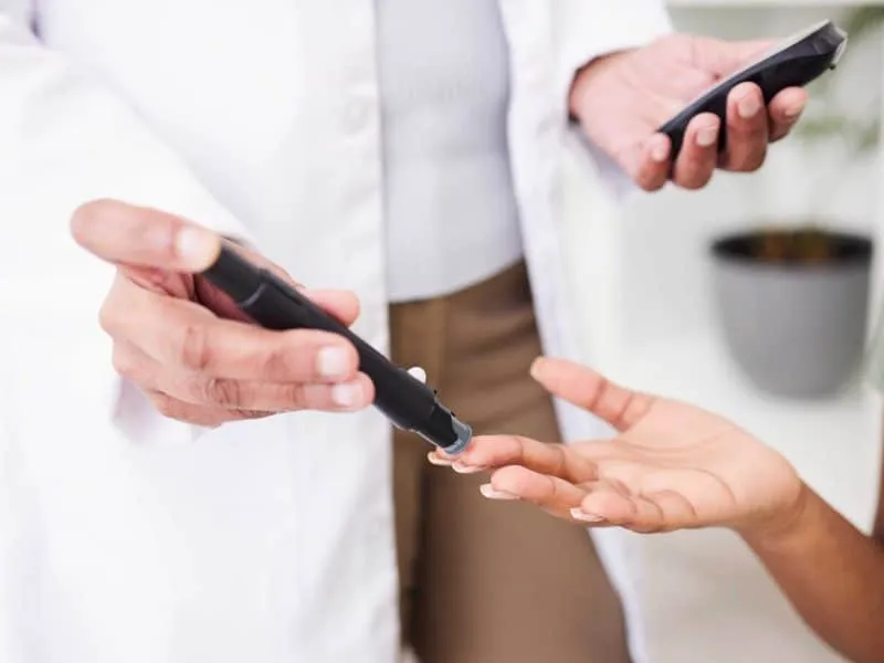 doctor getting blood test for diabetic patient