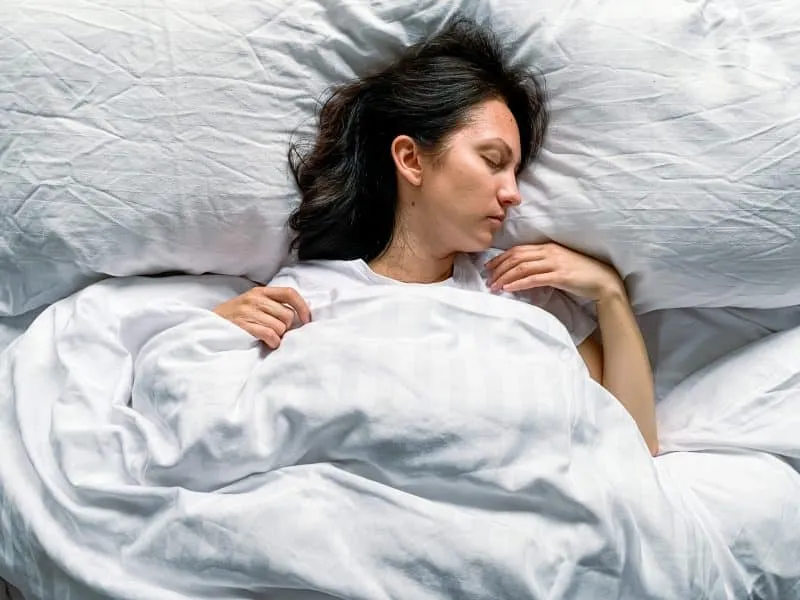young-millennial-candid-woman-sleeps-at-home-on-a-2024-12-07-19-48-55-utc