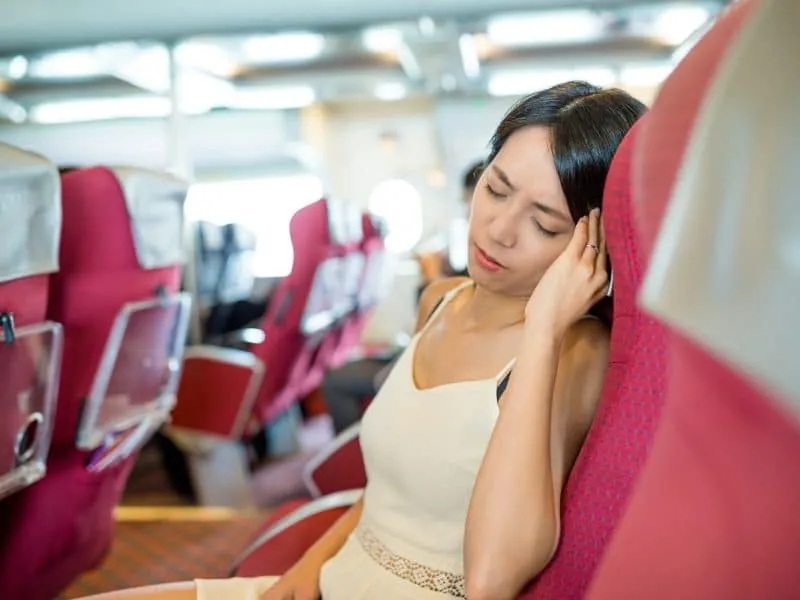Woman suffer from seasick on boat