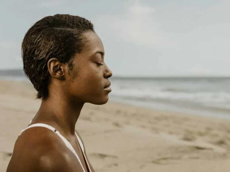 women meditating on the sea