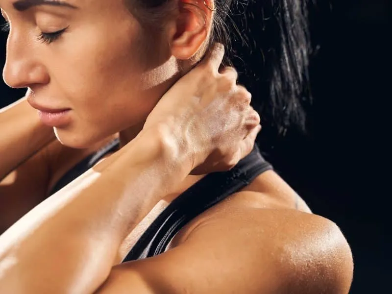 young female athlete with muscle spasms