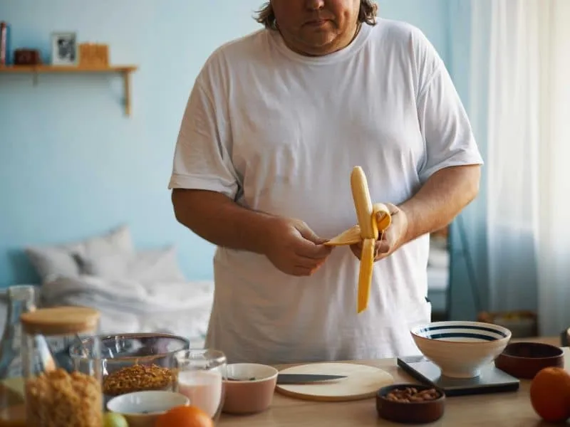 man preparing breakfast