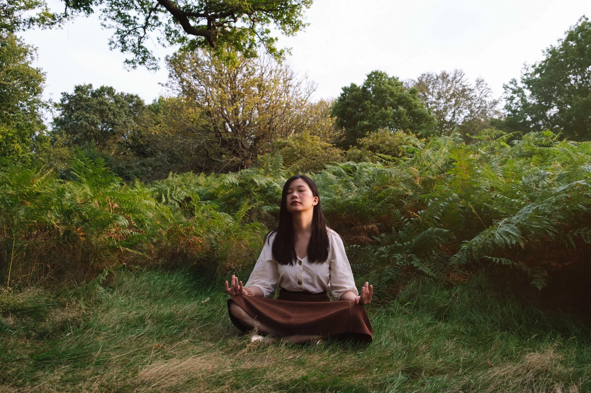 serene meditation of woman in forest